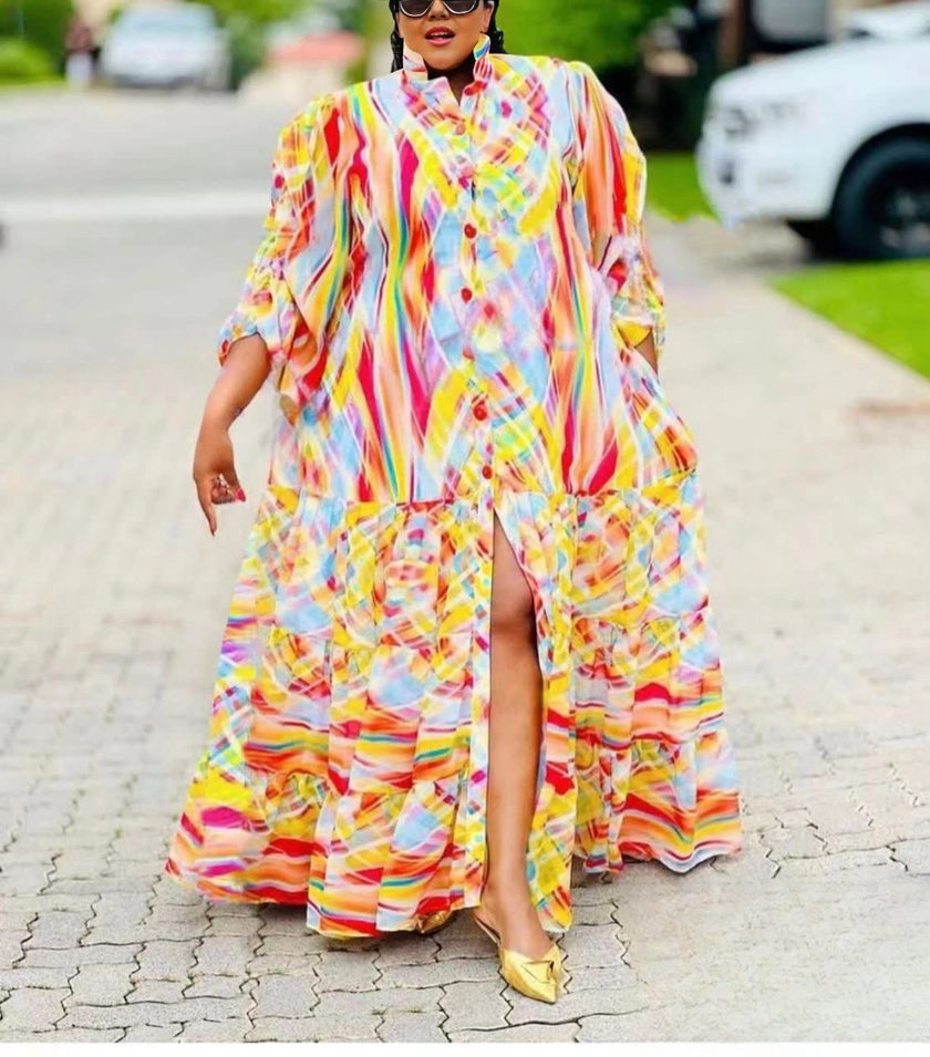 Colorful striped maxi dress with ruffle sleeves, ruffle hem, and front slit
