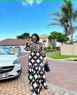Geometric maxi dress with long sleeves and wavy hem, black and cream