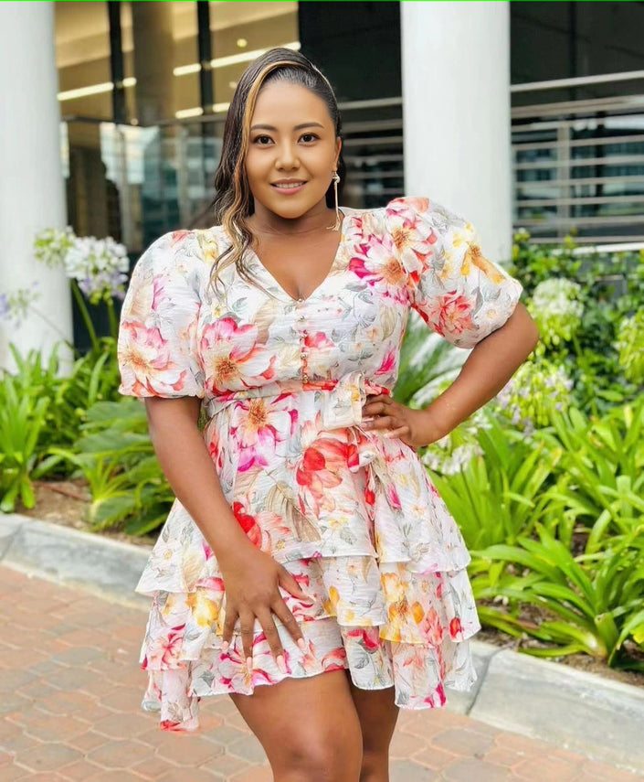 Floral ruffle mini dress with puff sleeves, tiered skirt, and V-neck
