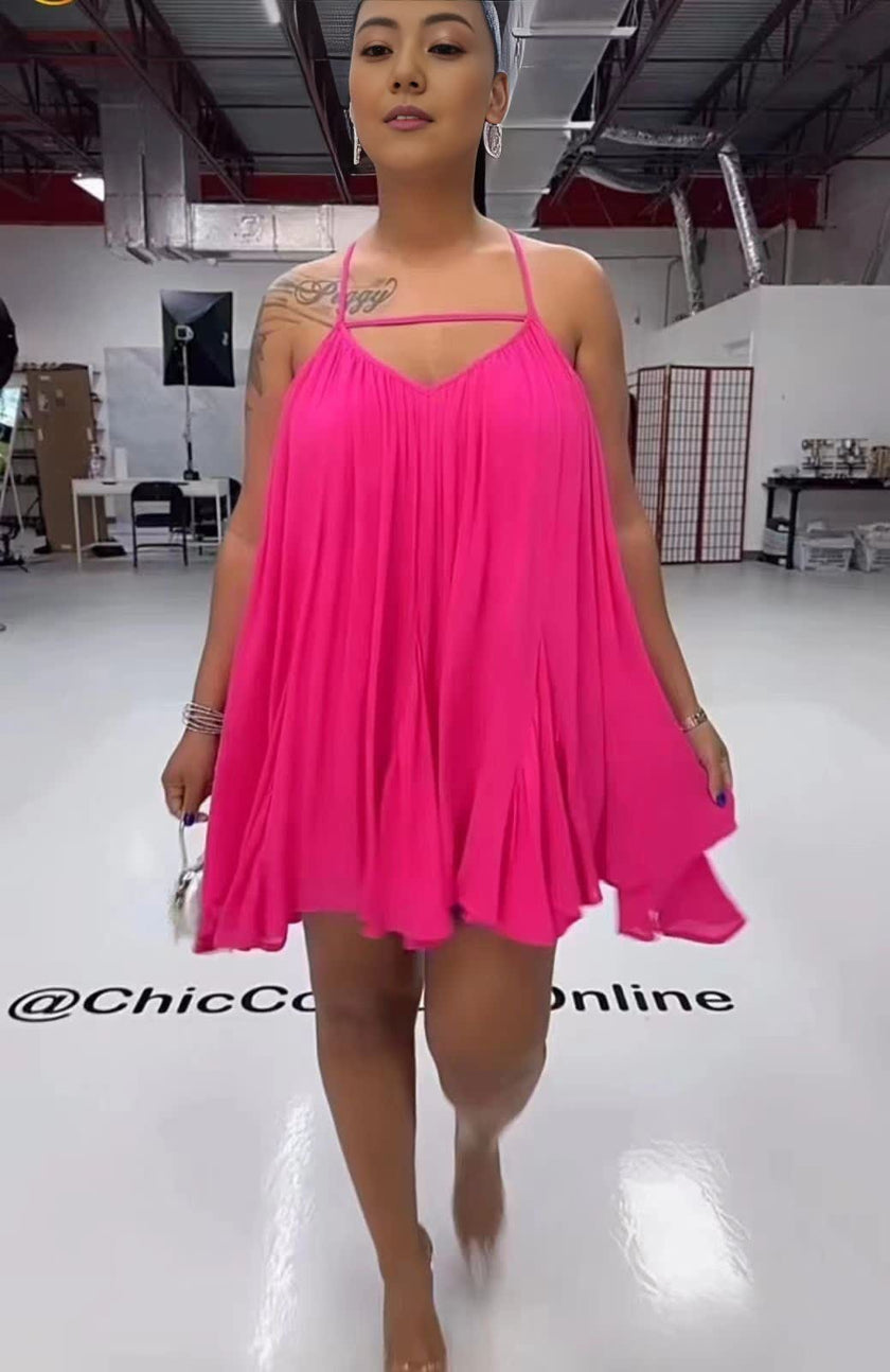 Sleeveless flared dress in deep pink with thin straps and V neckline