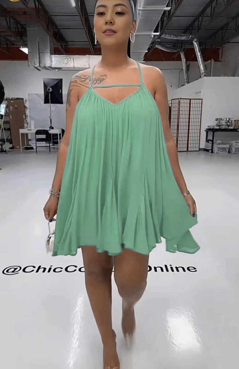 Sleeveless flared dress in pale turquoise with thin straps and V neckline