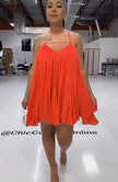 Sleeveless flared dress in orange-red with thin straps and V neckline