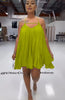 Sleeveless flared dress in green-yellow with thin straps and V neckline