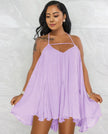 Sleeveless flared dress in light purple with thin straps and V neckline