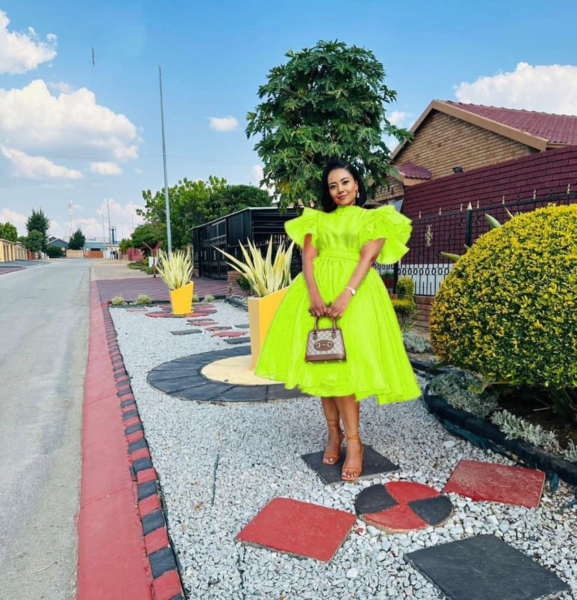 Neon green puff-sleeve midi dress with flared skirt and gathered bodice