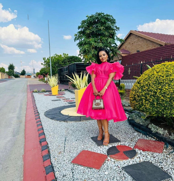 Pink puff-sleeve midi dress with flared skirt and gathered bodice