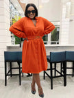 Orange midi dress with V-neck, long sleeves, button front, belted waist