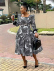 Floral midi dress with long puff sleeves, black-and-white pattern, square neckline, flared skirt