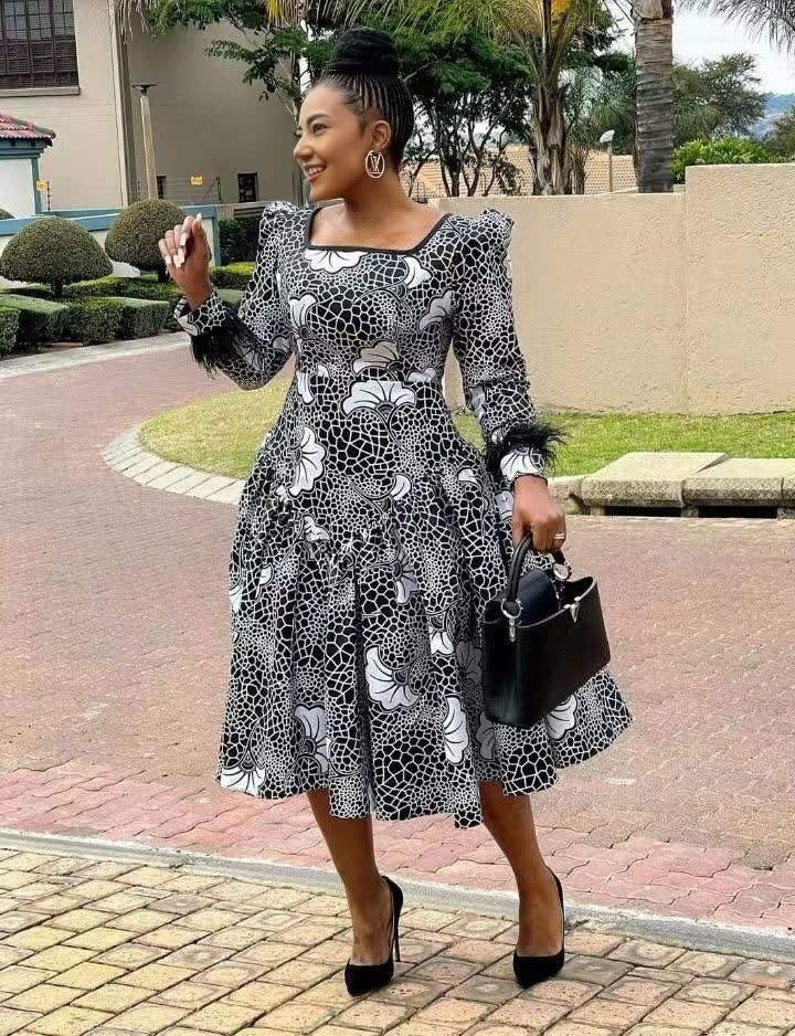 Floral midi dress with long puff sleeves, black-and-white pattern, square neckline, flared skirt