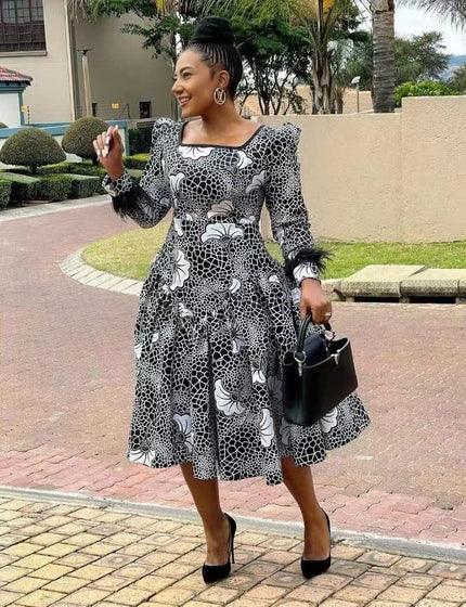 Floral midi dress with long puff sleeves, black-and-white pattern, square neckline, flared skirt