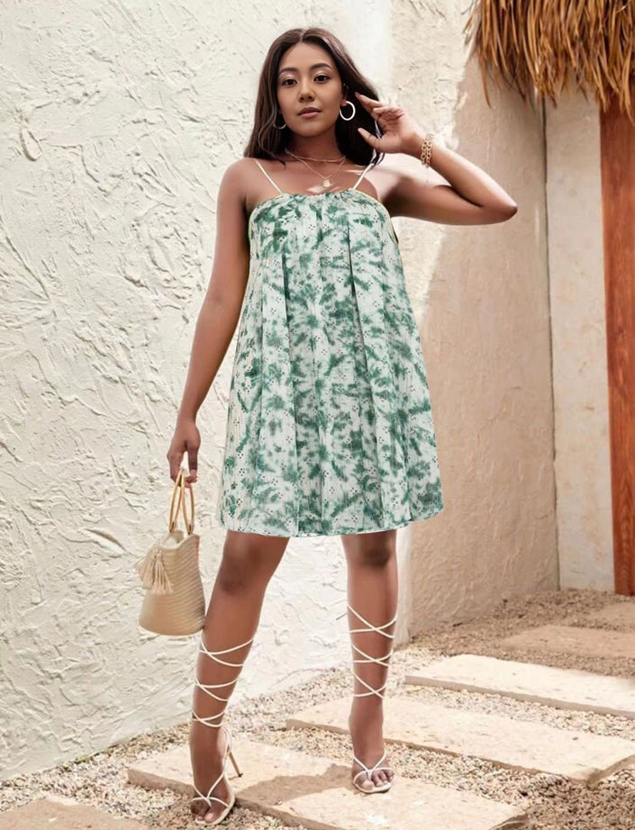 Strapless flared mini dress, light green floral print; lace-up leg ties and short hem.