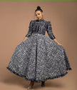 Geometric midi dress with full skirt, black and white pattern, high neck and 3/4 sleeves