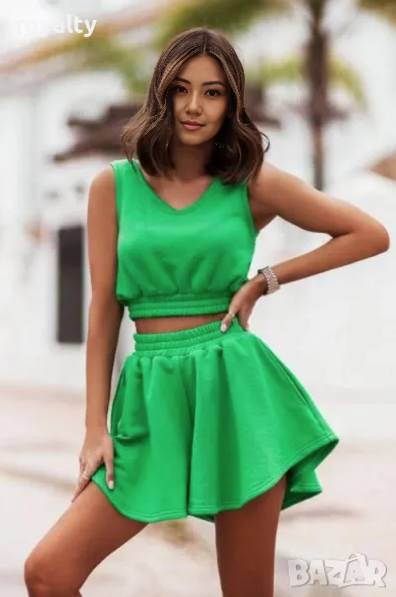 Green sleeveless cropped top and pleated mini skirt set with elastic waist