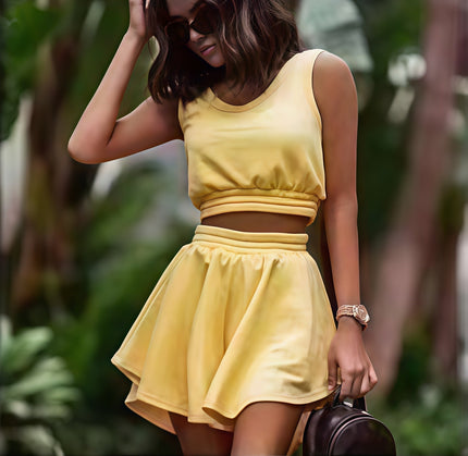 Yellow sleeveless cropped top and pleated mini skirt set with elastic waist