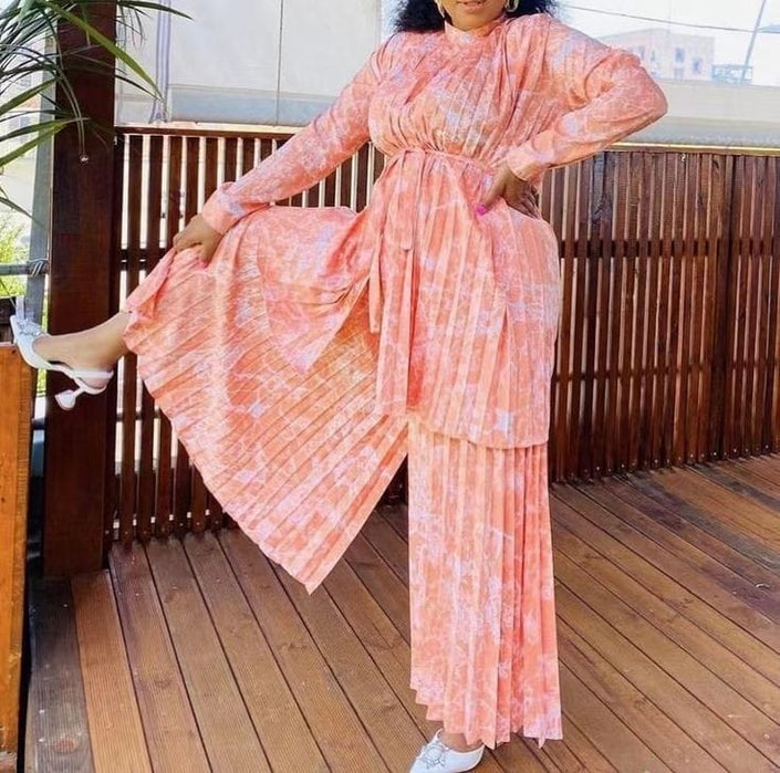 Peach pleated twin set with belted tunic and wide-leg pants, long sleeves