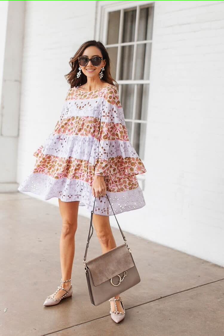 Floral layered dress in white with orange floral print, tiered ruffle design