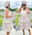 Sleeveless circular motif mini dress with tiered ruffle skirt, cream base