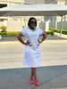Knee-Length Dress with Patterned Pockets and Round Neckline