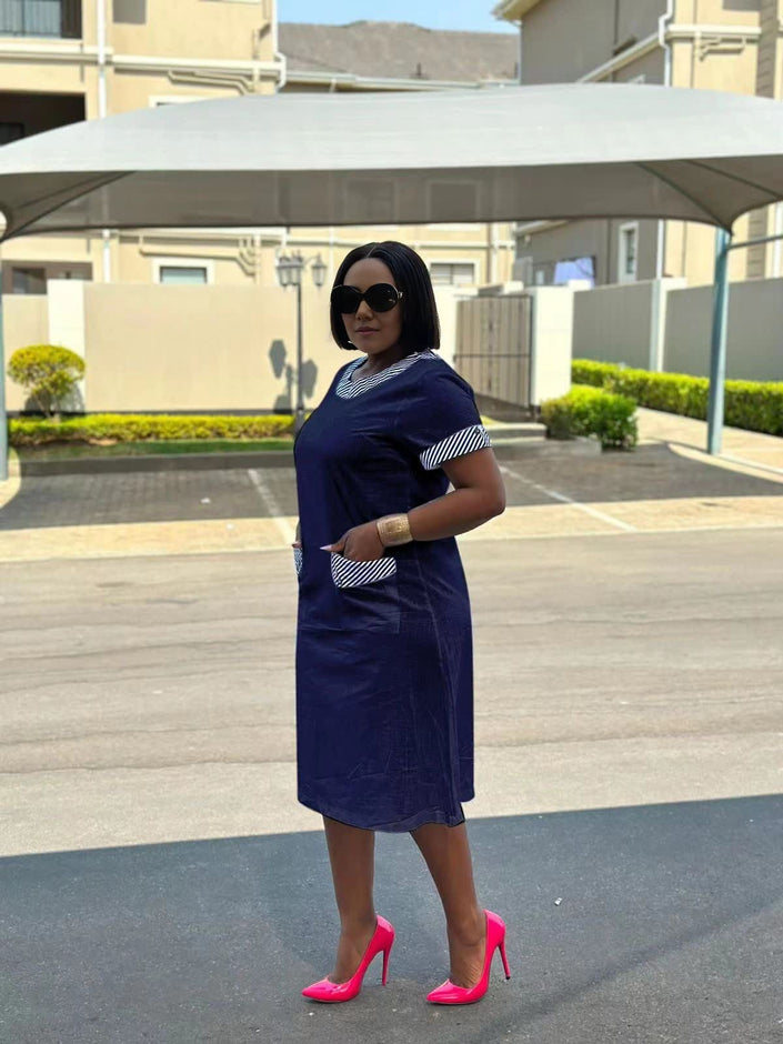 Navy blue plus size midi dress with short sleeves and patterned pocket accents