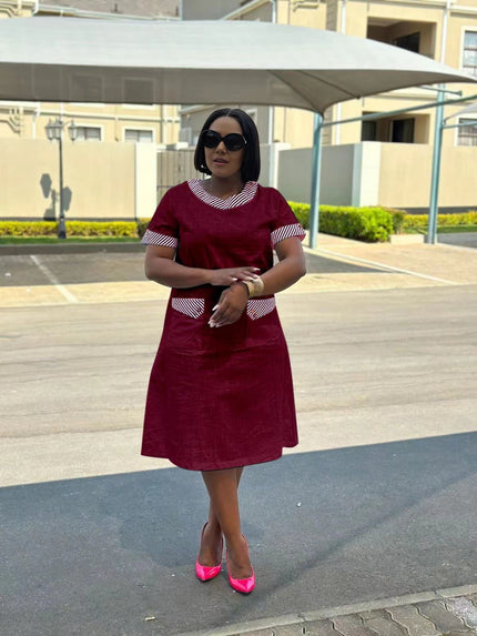 Maroon plus size midi dress with short sleeves and patterned pocket accents