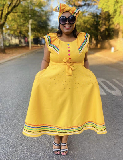 Yellow plus size ruffle sleeve dress with bow front and multicolor hem trim