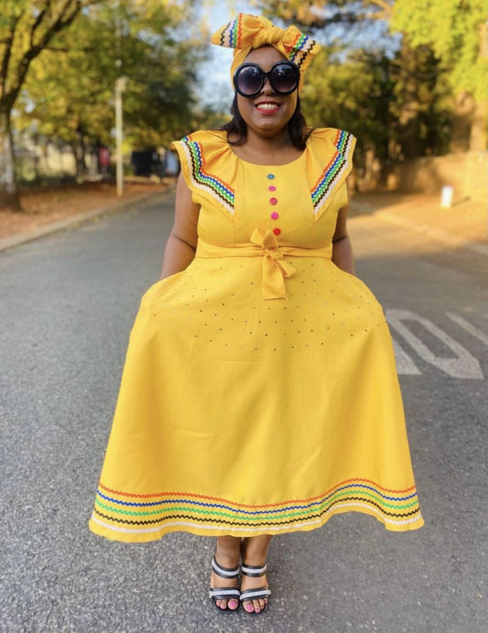 Yellow plus size ruffle sleeve dress with bow front and multicolor hem trim