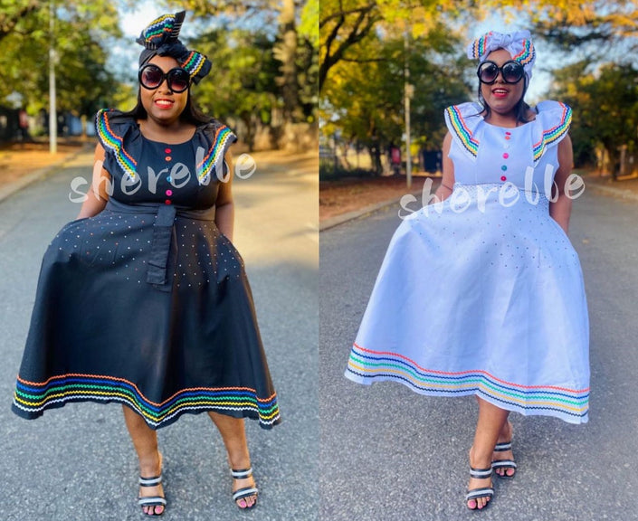 Plus size ruffle sleeve dress with multicolor trim and buttoned bodice