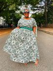 Green and white printed maxi dress with full skirt and wide belt