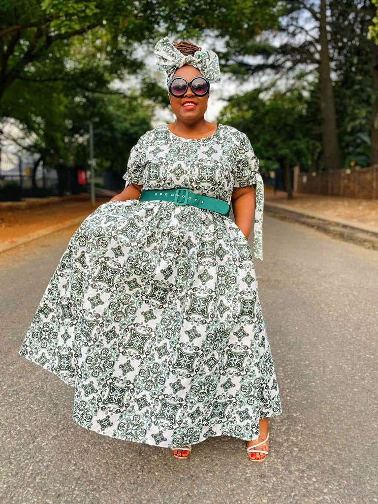 Green and white printed maxi dress with full skirt and wide belt