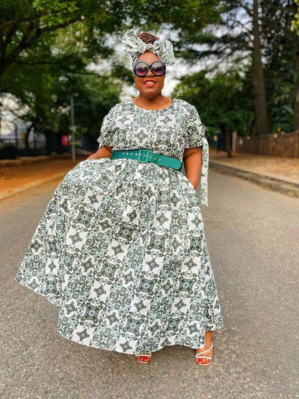 Green and white printed maxi dress with full skirt and wide belt