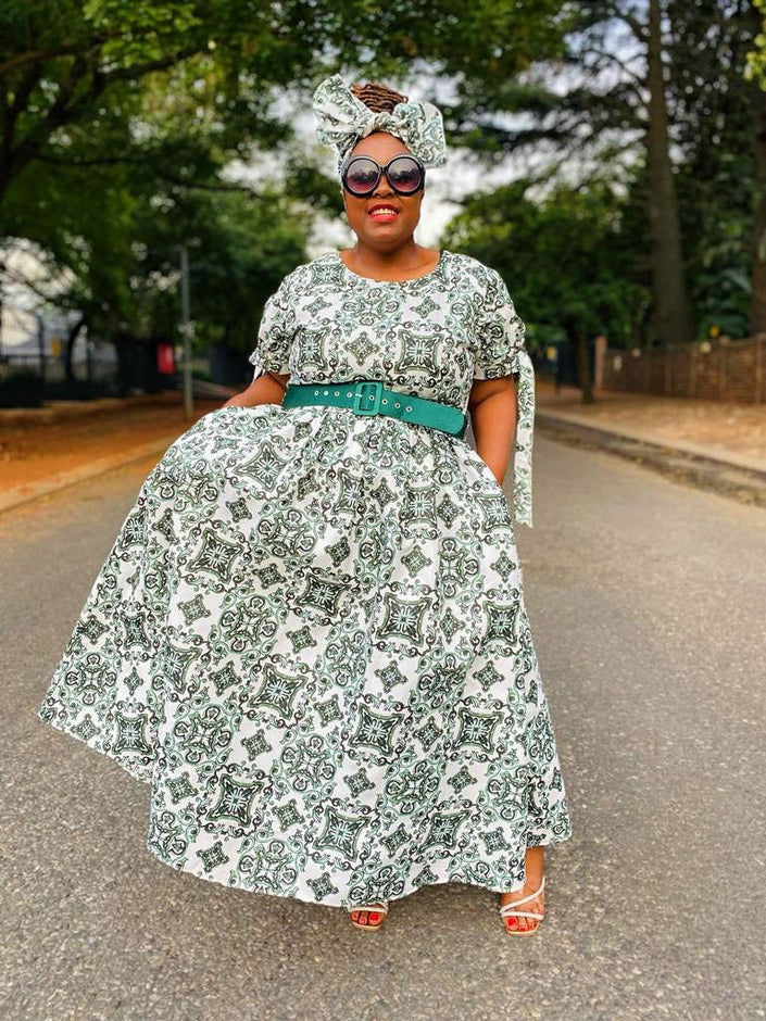 Green and white printed maxi dress with full skirt and wide belt