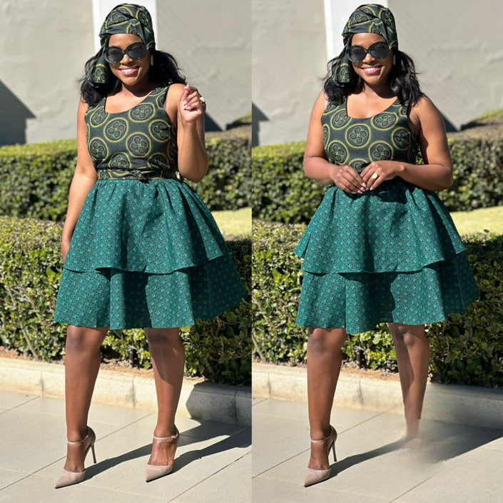 Green patterned ruffle skirt dress with sleeveless bodice and layered tiered skirt