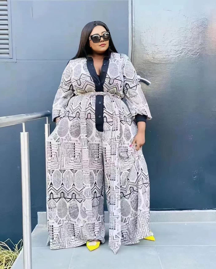 Printed wide-leg button-up jumpsuit, long sleeves, black and white geometric pattern