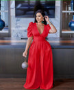 Red puff-sleeve V-neck wide-leg jumpsuit with gathered waist