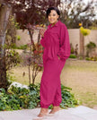 Magenta collared long-sleeve jumpsuit with front zipper and gathered elastic waist