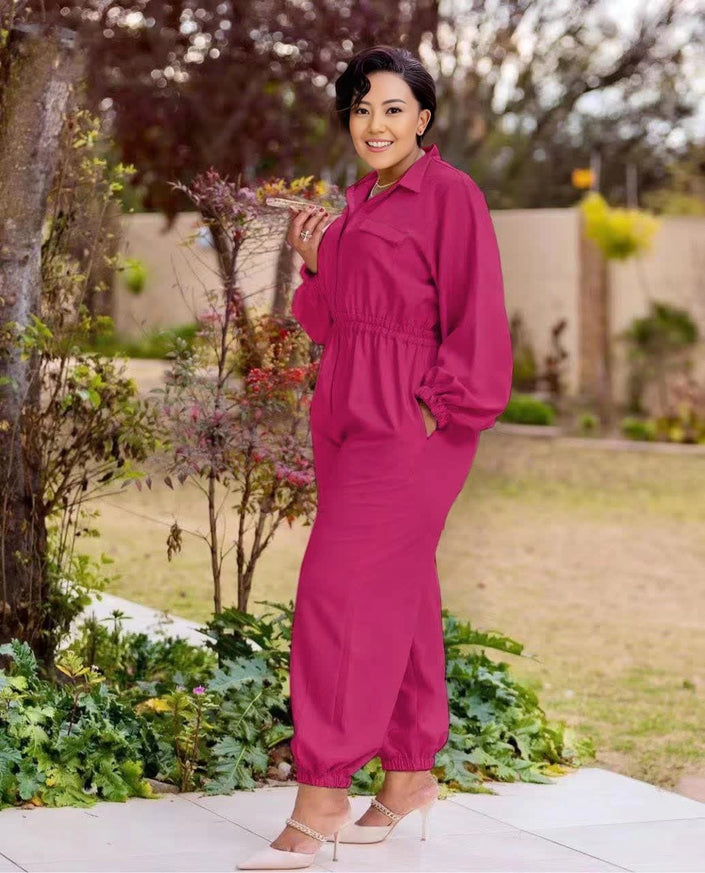 Magenta collared long-sleeve jumpsuit with front zipper and gathered elastic waist