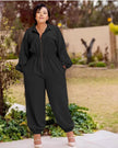 Black collared long-sleeve jumpsuit with front zipper and elastic waist