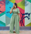 Green V-neck puff-sleeve stretch-waist jumpsuit with wide legs