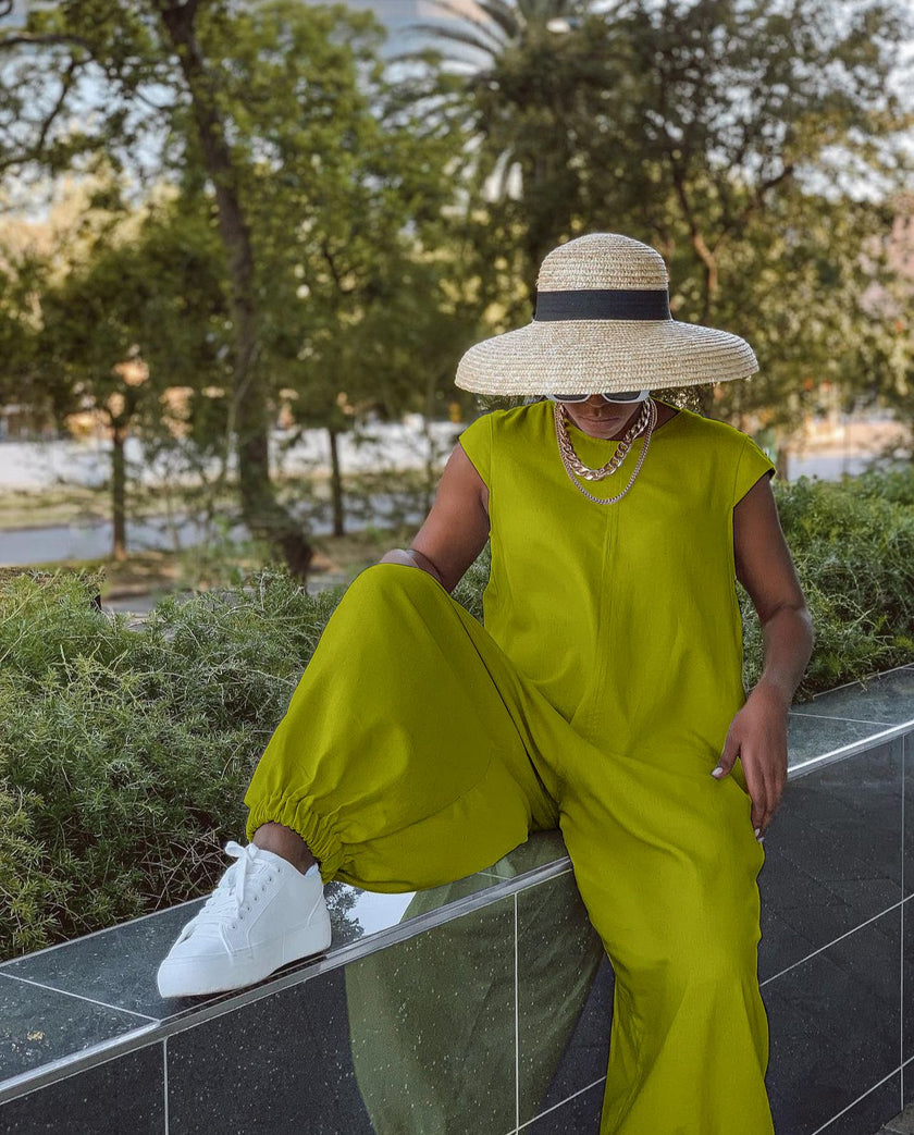Lime green crew-neck wide-leg jumpsuit with wide, billowy pant legs.