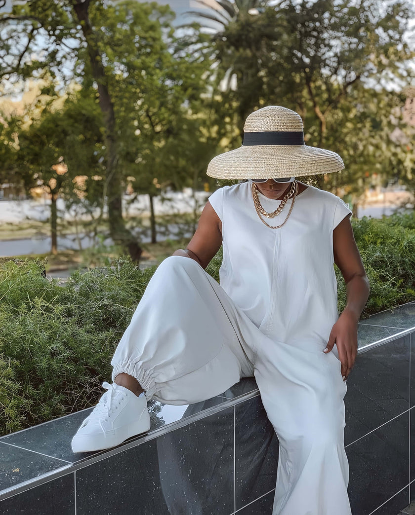Light blue crew-neck wide-leg jumpsuit with relaxed fit and gathered waist.