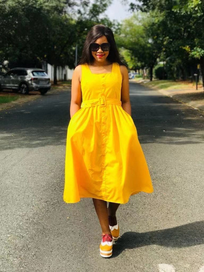 Yellow sleeveless midi dress with belt and button front