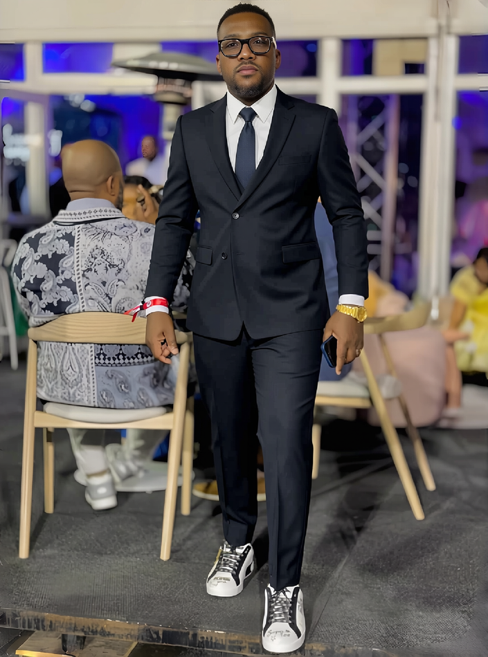 Men's slim-fit formal suit, full look with dark blazer, vest, and matching trousers.