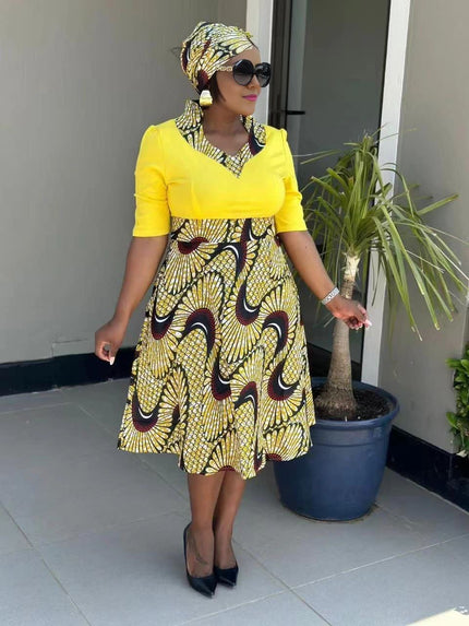 Pleated African print midi dress with yellow top and flared skirt, short sleeves, V-neck