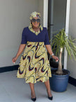 Pleated African print midi dress with navy top and flared patterned skirt, short sleeves, V-neck