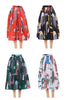 Pleated midi skirt with printed bird pattern in red, green, and blue