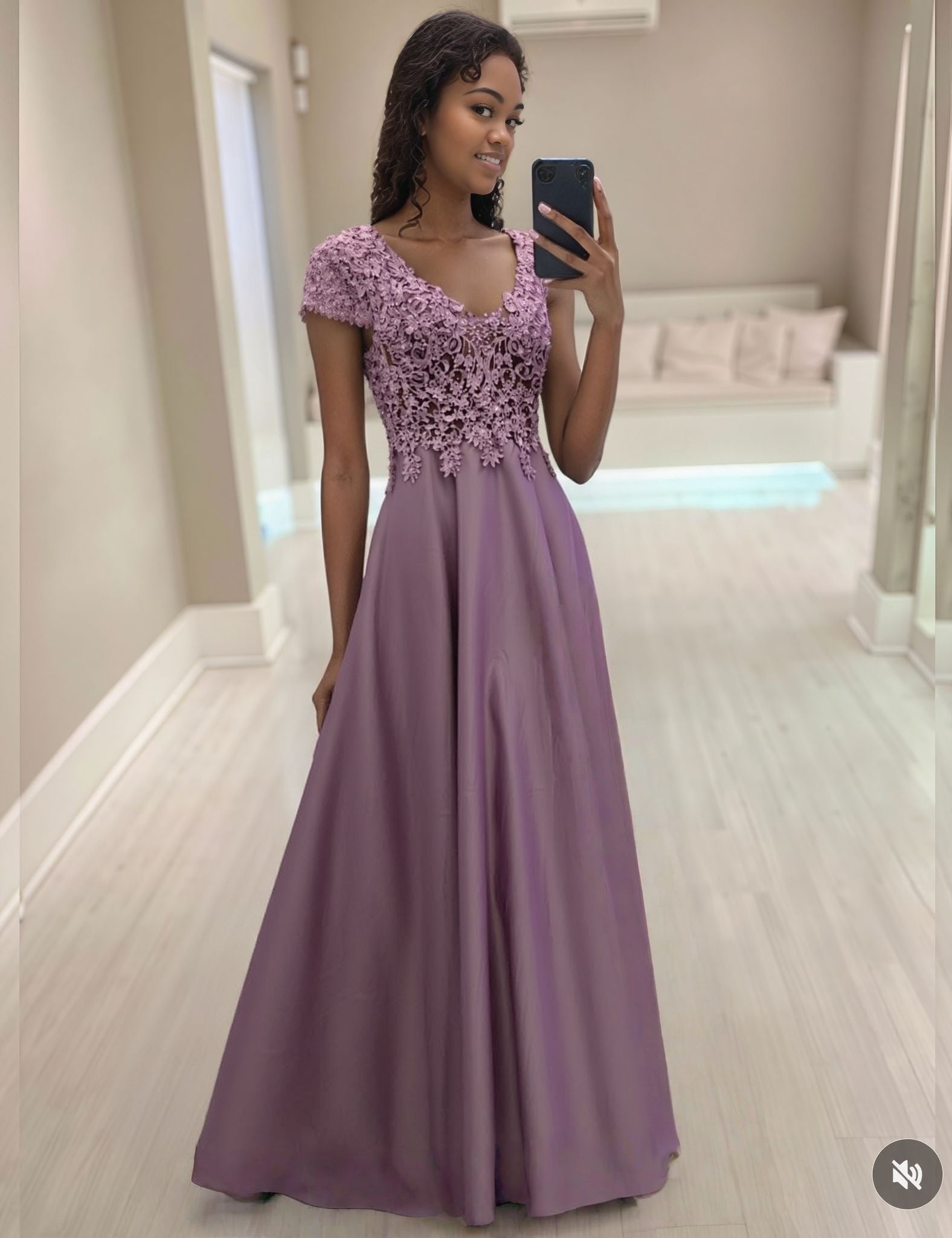 Floral evening dress with lace bodice, short sleeves, and full floor-length skirt