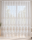 White sheer curtain with ornate beige embroidery and a floral geometric border