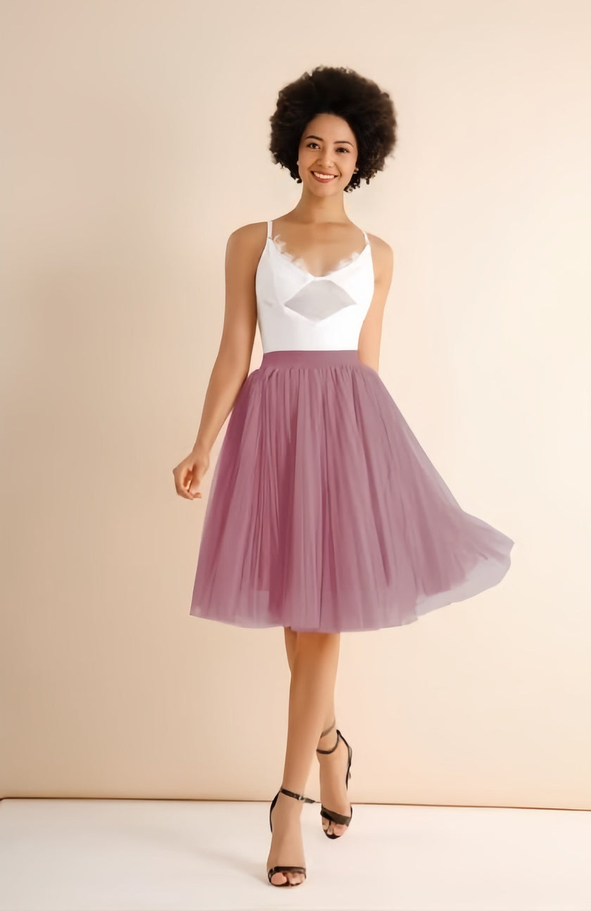 Light pink pleated midi skirt with stretch waistband, flared A-line silhouette