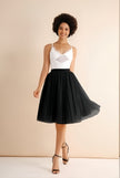 Black pleated midi skirt with stretch waistband, flared A-line silhouette