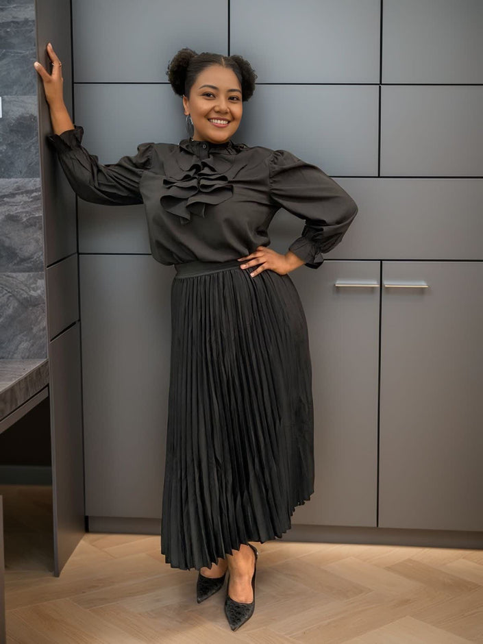 Black ruffle puff-sleeve blouse with gathered collar and voluminous shoulders